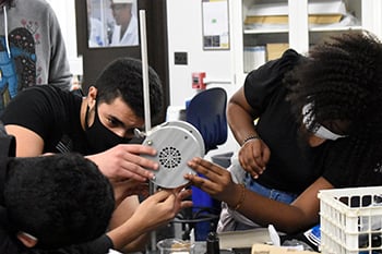 Photo of Students working on a Thruster