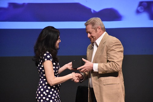 President Mary-Rita Moore (left) with retiring automotive faculty member Stewart Sikora