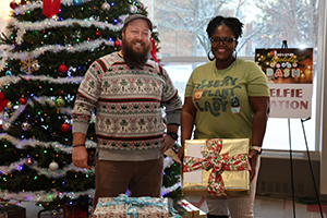 Photo of Staff posing in front of Cafeteria Christmas Tree