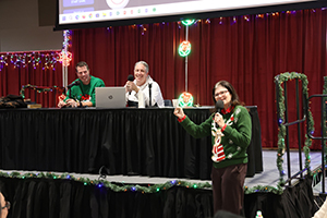 Photo of President Moore, Mike Garrity and Mark Jason calling out bingo numbers