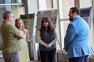 Photo of Faculty having a discussion