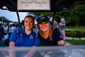 Golfers ready for tee off in their cart