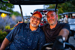 Golfers ready for tee off in their cart