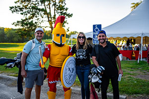 Glow Golf 2025 25 Group of golfer with Troy the mascot at check in