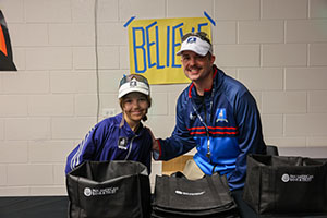 Family dressed in costume handing out candy at Trunk or Treat