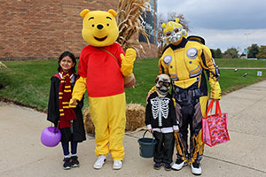 Kids dressed in costume for Halloween at Trunk or Treat in Space 