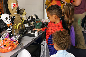 Child looking at decorations at Trunk or Treat 