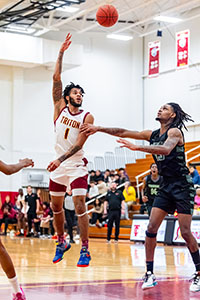 Photo of Triton Male Basketball Player making a hook shot