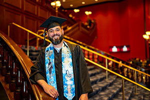 Photo of Graduate posing on stairway