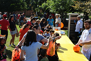 Photo of Guest gathering around a food table