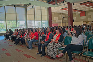 Photo of Graduates and Attendees in audience